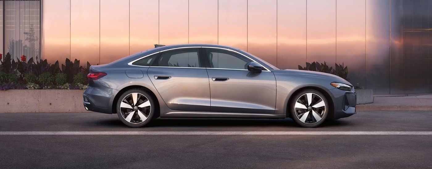 A grey 2025 Audi A5 for sale on a driveway.